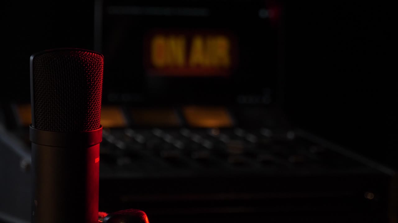 Microphone in the studio on the air with a mixing board