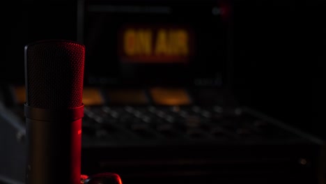 microphone in the studio on the air with a mixing board