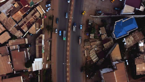 aerial view above cars on a road in yaounde city, cameroon - cenital, drone shot