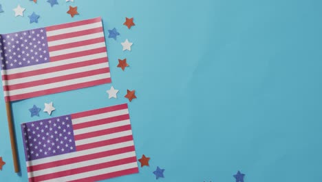 American-flags-with-red-and-blue-stars-lying-on-blue-background