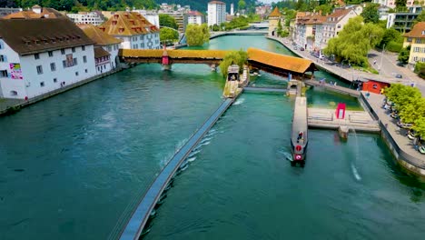 4k drone video of the spreuerbrücke bridge and lucerne needle dam on the reuss river near lake luzerne in lucerne, switzerland