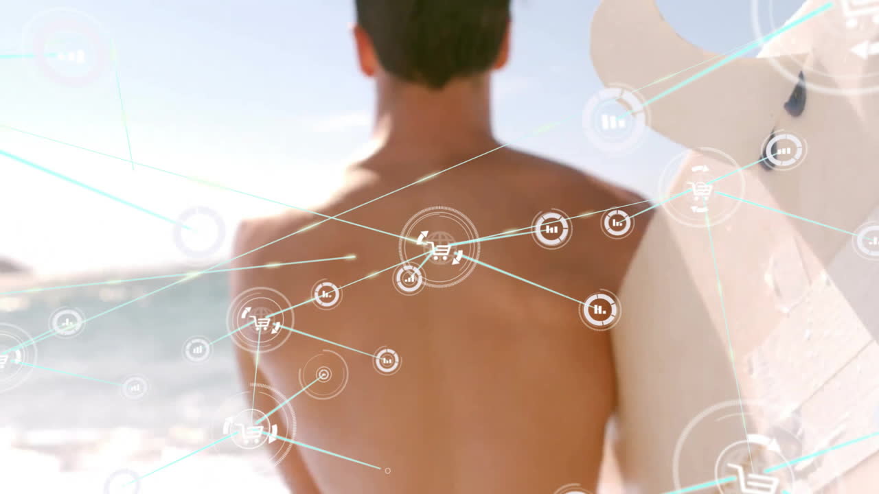 Holding surfboard at beach, man surrounded by digital network animation icons