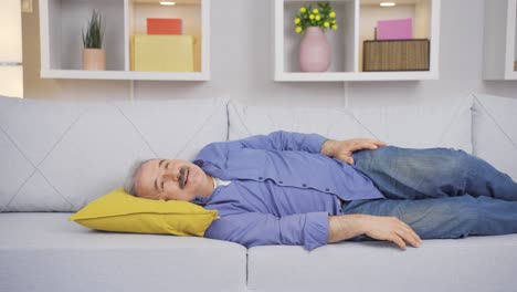 The old man lying on the sofa, serene and peaceful.