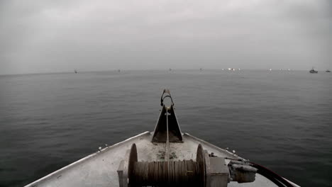 several boats navigate in open waters