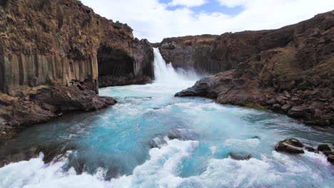 drone aerial view of the aldeyjarfoss waterfall in north iceland.