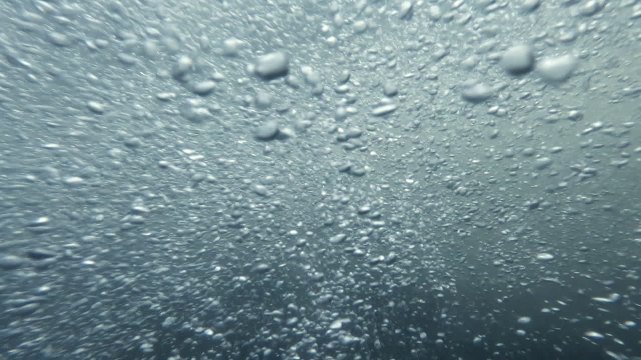 Underwater footage, Air bubbles in mountain river with clear water,stream flowing over stones,