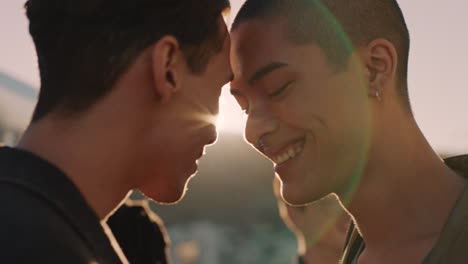 young homosexual couple sharing intimate connection enjoying rooftop party at sunset dancing together group of friends having fun celebrating summer vacation