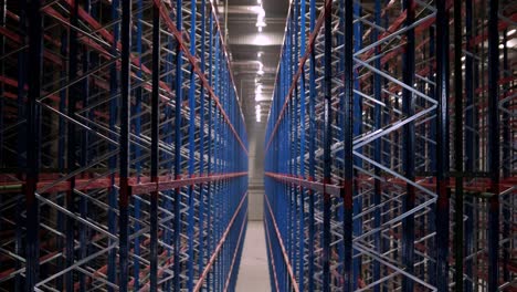 big and modern warehouse under construction, featuring metal shelving and other industrial equipment.