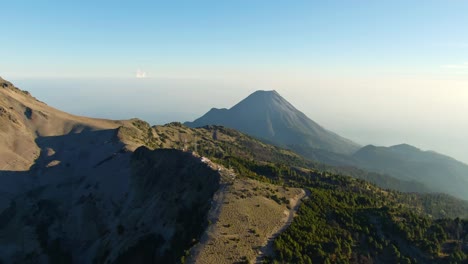 Panoramic aerial of the majestic Colima Volcano, view from the Nevado de Colima National Park near the Mirador Volcan de Fuego