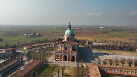 a stunning drone circling shot captures the beautiful lombardy region's santuario di caravaggio, an iconic italian pilgrimage site