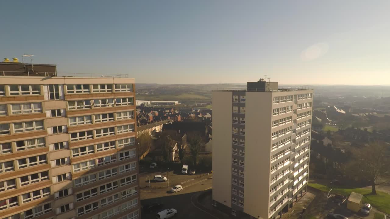 Aerial footage view of high rise tower blocks, flats built in the city of Stoke on Trent to accommodate the increasing population, council housing crisis, Immigration housing