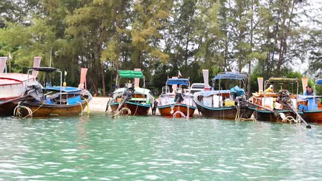 colorful boats docked along a scenic shoreline