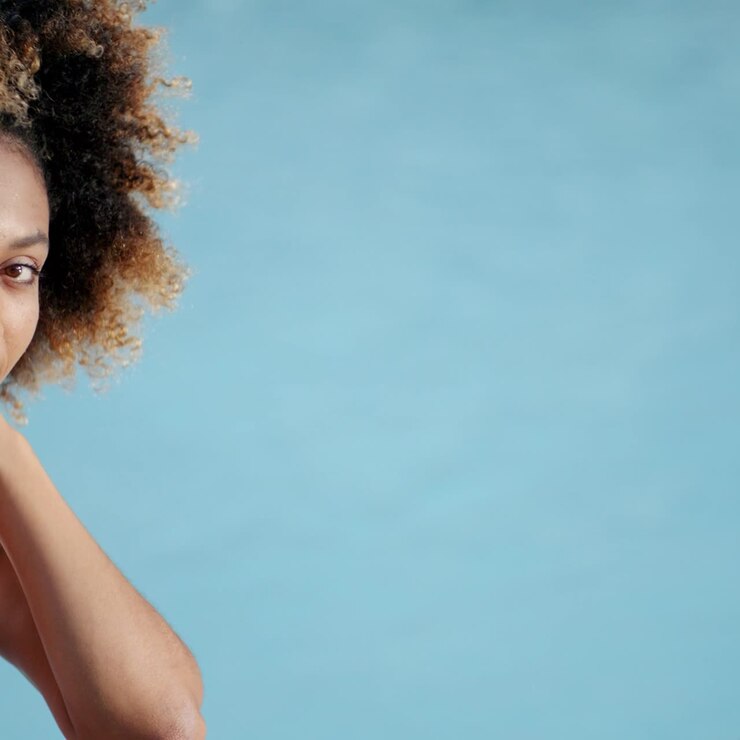 Woman Taking Sunbath Near Swimming Pool