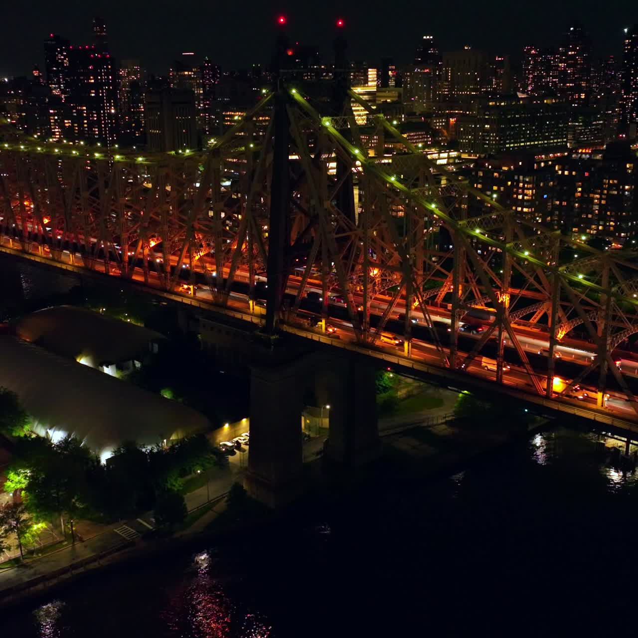 Gorgeous lighting of Queensboro Bridge at night. Stunning city scenery of New York at backdrop
