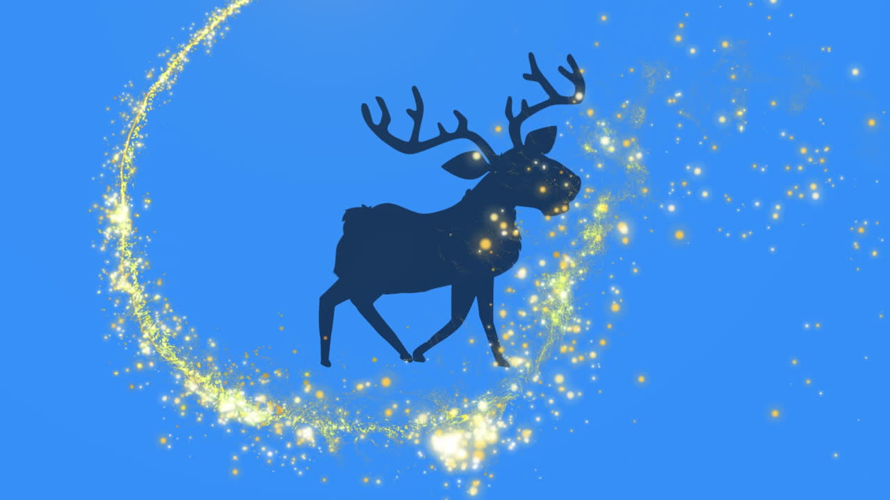 estrella fugaz dorada sobre la silueta de renos caminando contra un fondo azul