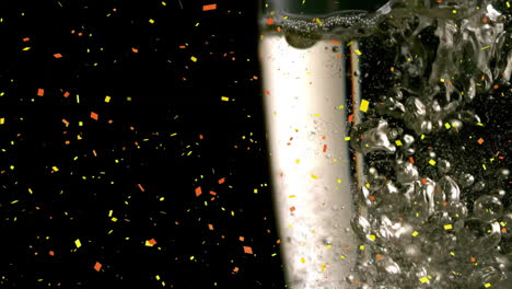 confetti animation over champagne glass with bubbles, celebrating special occasion