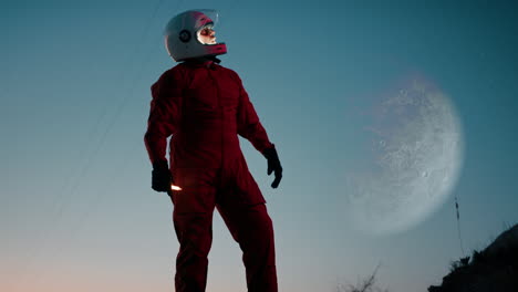 silhouette of an astronaut explores a new abandoned planet at night