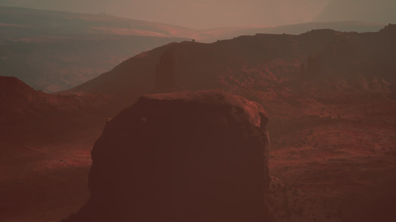 un paisaje marciano con montañas rojas y un desierto rocoso