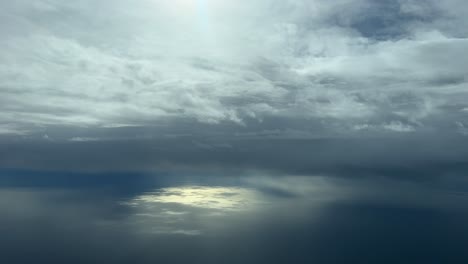 winter cloudy sky over the mediterranean sea during descent to valencia’s airport