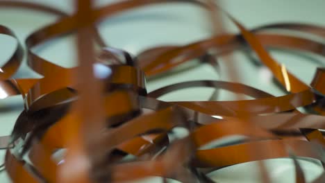 tape unreel. pulling the tape out. destroying cassette tape media. scene a