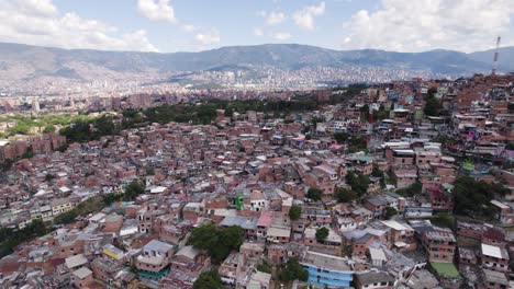 Dense-housing-of-Medellin's-Comuna-district-favela,-Colombia---aerial-fly-over