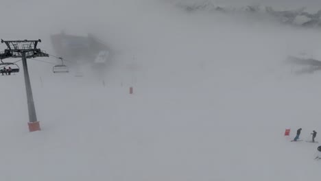 Aerial-view-of-famous-alpine-ski-resort-Verbier,-Switzerland-in-winter-Swiss-Alps,-snow-on-mountain-slopes,-landscape-panorama-of-Europe