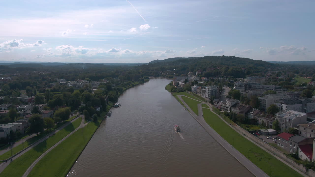 Drone shot of boat in Vistula river in Krakow in Poland