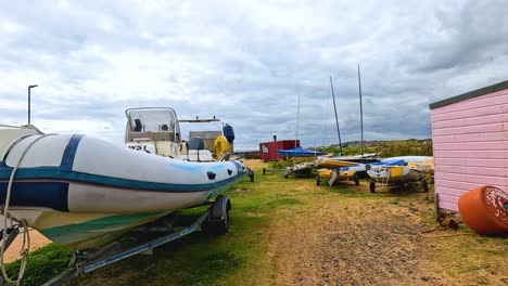 boats and trailers on a cloudy day