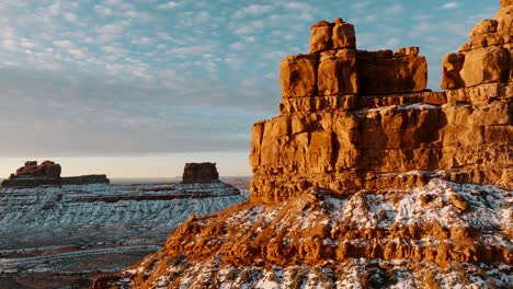 flying drone cinematic shot close to rock during sunrise valley of the gods utah