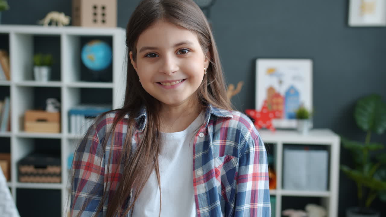 Smiling Girl in a Plaid Shirt