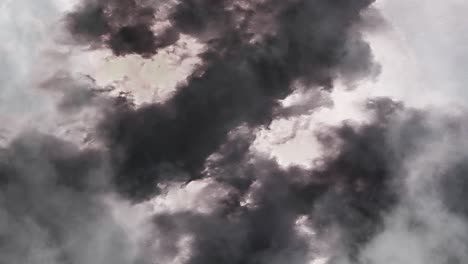 dark clouds moving closer with a bolt of lightning in them