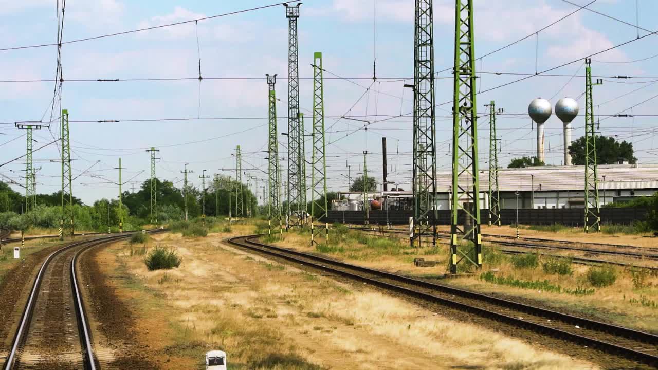 Looking out the window to the rails of a moving train, slow motion, gimbal shot