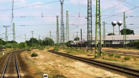 looking out the window to the rails of a moving train, slow motion, gimbal shot