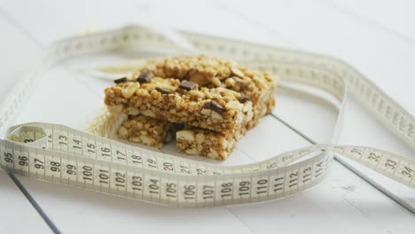 granola bars with dried fruits wooden background