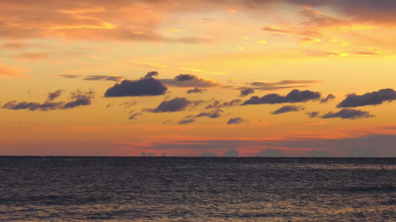 Time lapse stunning dawn sky, clouds moving over dark Mediteranean sea.