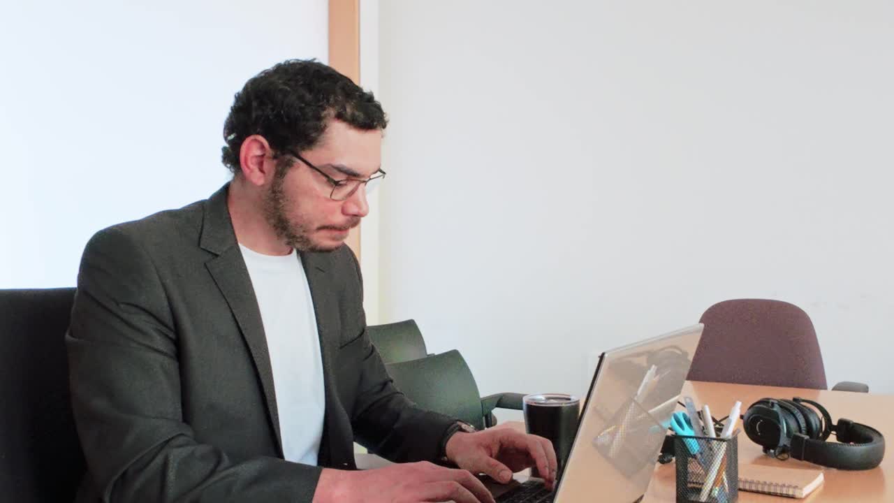 Young Businessman Takes Coffee Break