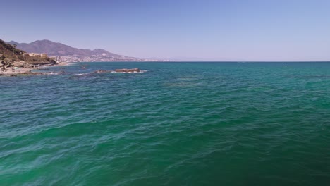 aerial flying sideways on the mediterranean sea, spain