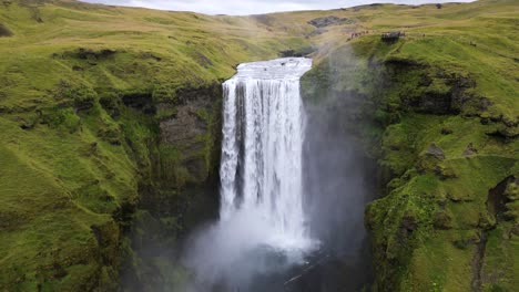 powerful skogafoss waterfall, popular tourist spot in iceland in summer - aerial