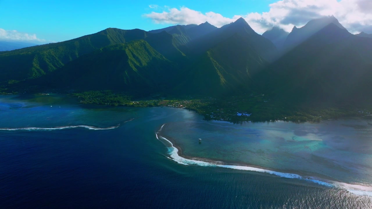 Teahupo'o wave surf spot WSL tour early morning Tahiti lagoon aerial drone harbor view French Polynesia Passe Havea vibrant coral reef South Pacific Ocean island landscape sunny coastline circle left