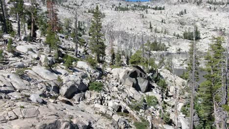 a cute girl backpacking in the desolation wilderness of sierra nevada mountains in california