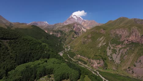 aerial establishing shot with mount kazbek, georgia in background