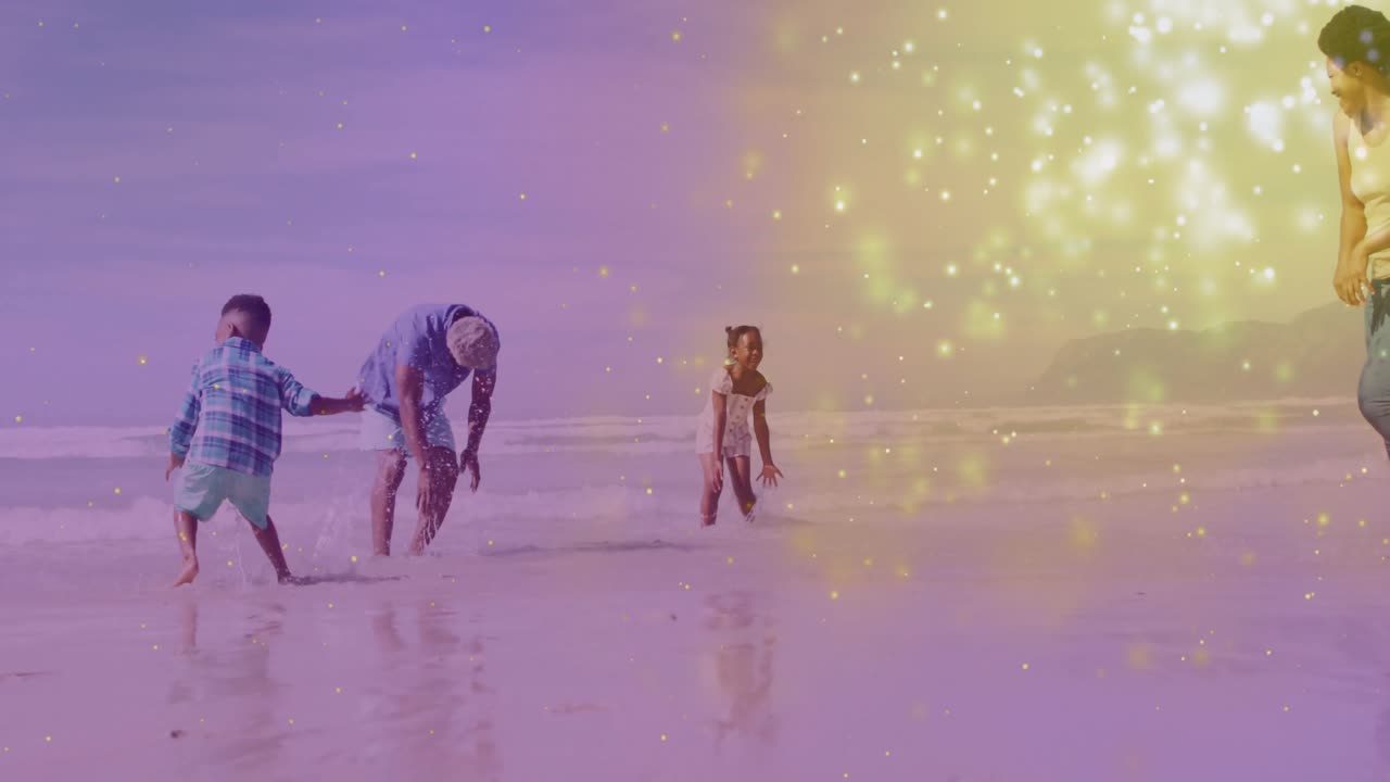 Boy dashing toward granddad family chasing, splashing in sea for health with gold sparkles overlay