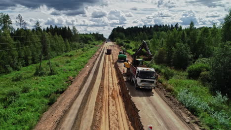 Excavator-destroying-nature-digging-plants-and-forest-trees-for-build-new-infrastructure-road