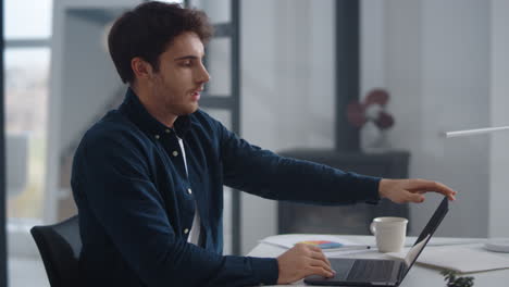 tired business man typing laptop keyboard