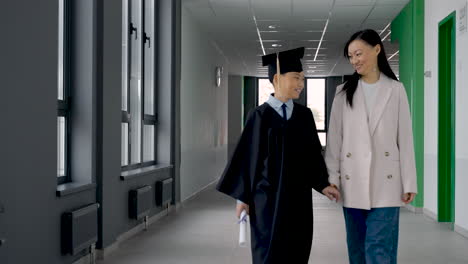 mom hugging and walking with her son