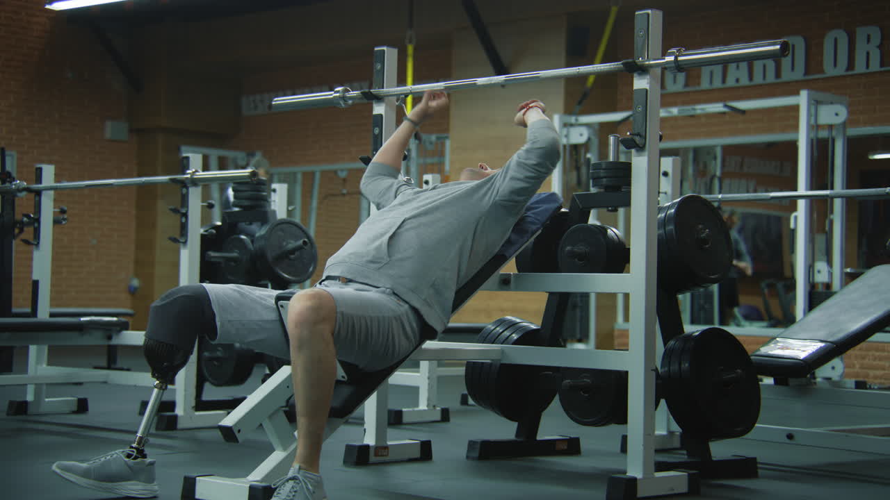 Man with a Prosthetic Leg Working Out at the Gym