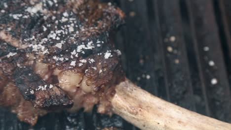 juicy tomahawk steak on grill