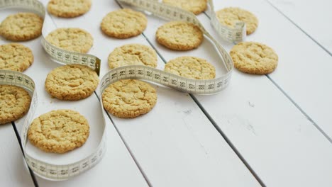 healthy oatmeal cookies on white wood background  side view