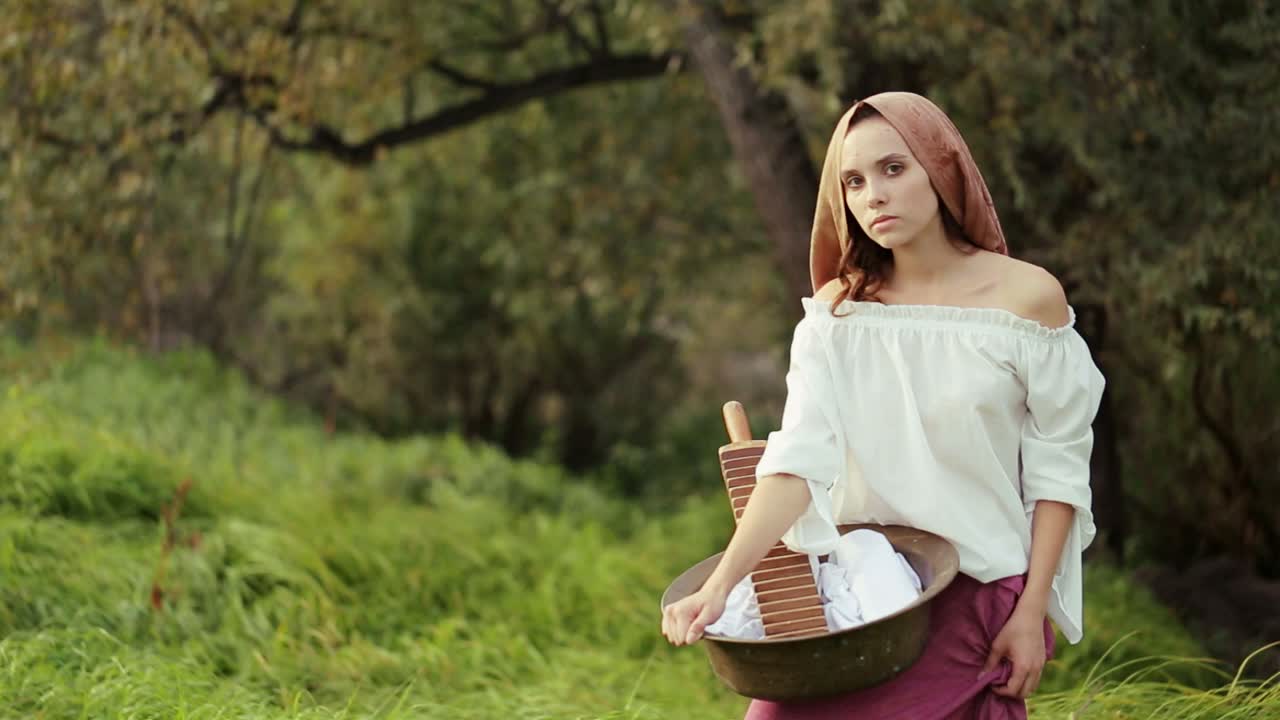 Woman washing clothes in the countryside