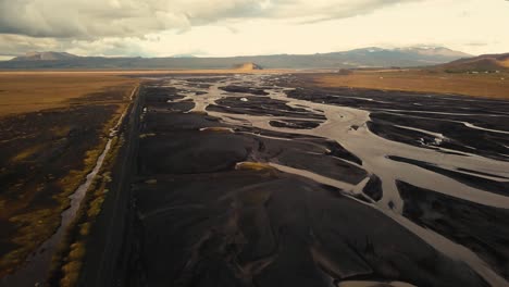 Various-shots-by-drone-of-an-icelandic-glacial-river-in-beautiful-sunset-light